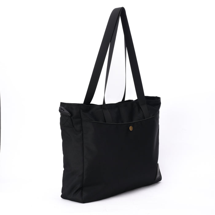 Black tote bag with long shoulder straps and front pocket against white background
