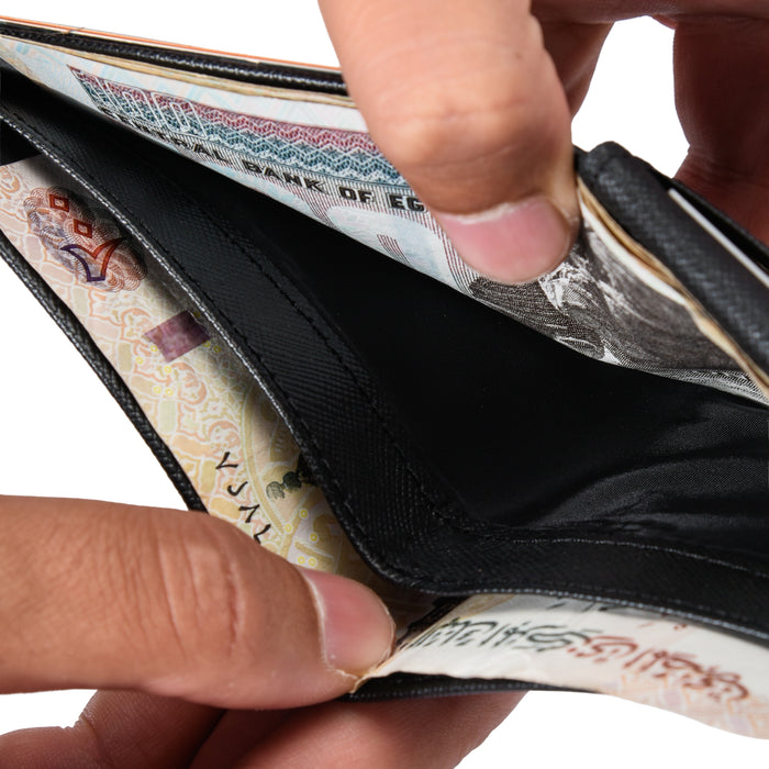 Close-up of hands opening a black wallet with visible Egyptian currency inside.
