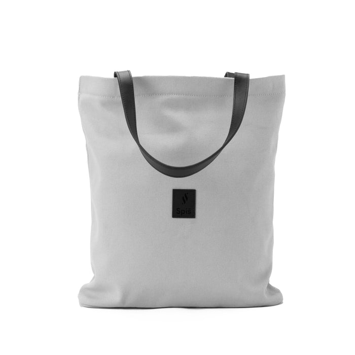 Minimalist grey canvas shoulder bag with black handles and front logo patch