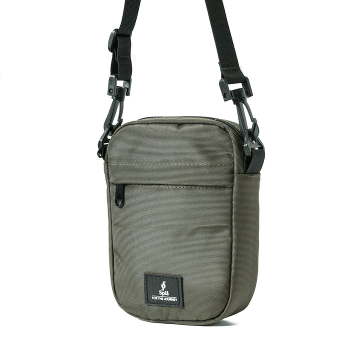 Olive green cross bag travel pouch with front zipper pocket and adjustable strap